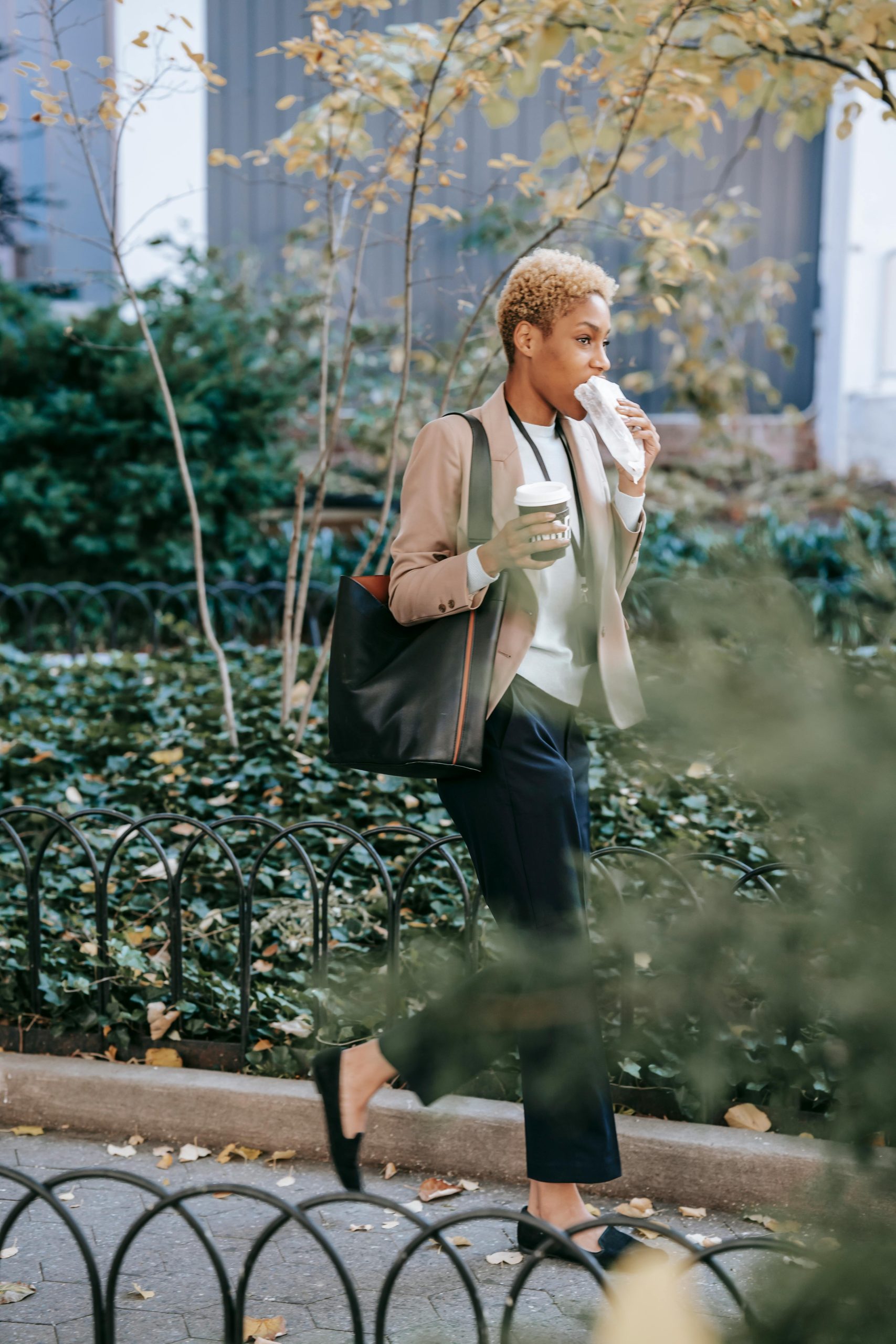 A worker eating while walking