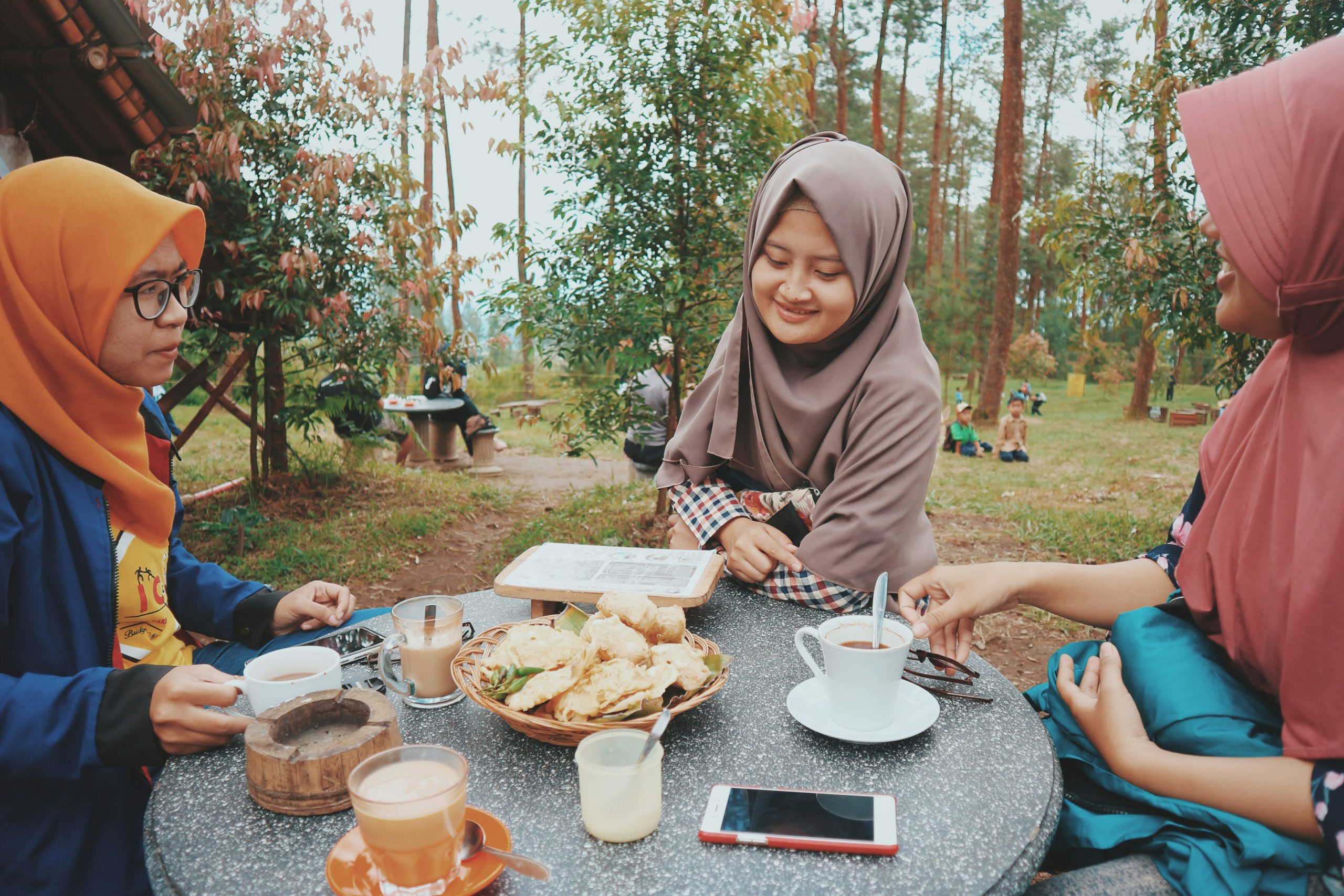 Women sitting around a table celebrating Eid Al-Fitr