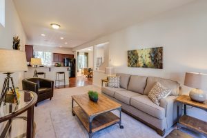 Living room of a house decorated with neutral toned colors
