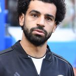 Arab man with dark hair and beard (Mohamed salah) in an athletic shirt