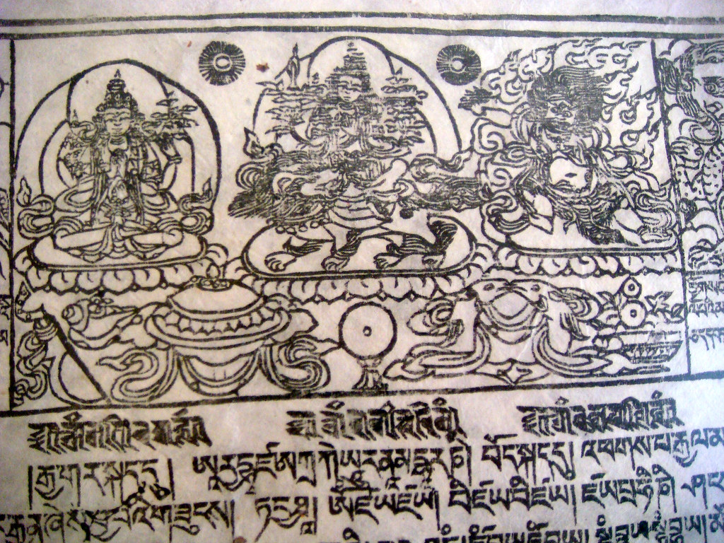 A detailed black illustration of deities and text from a Tibetan woodprint featuring multiple figures in various poses and settings.