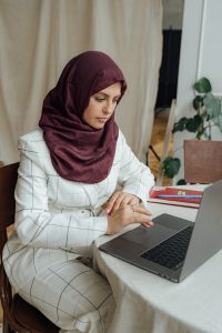 female student working on macbook