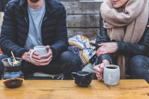 two people having tea together