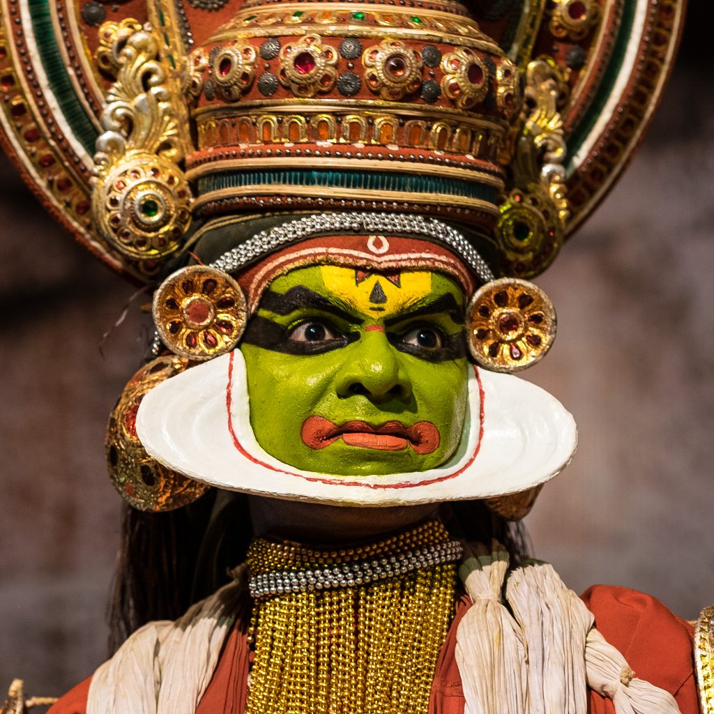 Kathakali (Malayalam: കഥകളി, kathakaḷi) is a stylized classical Indian dance-drama noted for the attractive make-up of characters, elaborate costumes, detailed gestures and well-defined body movements presented in tune with the anchor playback music and complementary percussion. The themes of the Kathakali are religious in nature. They typically deal with the Mahabarat, the Ramayana and the ancient scriptures known as the Puranas. This is performed in a text which is generally Sanskritised Malayalam.