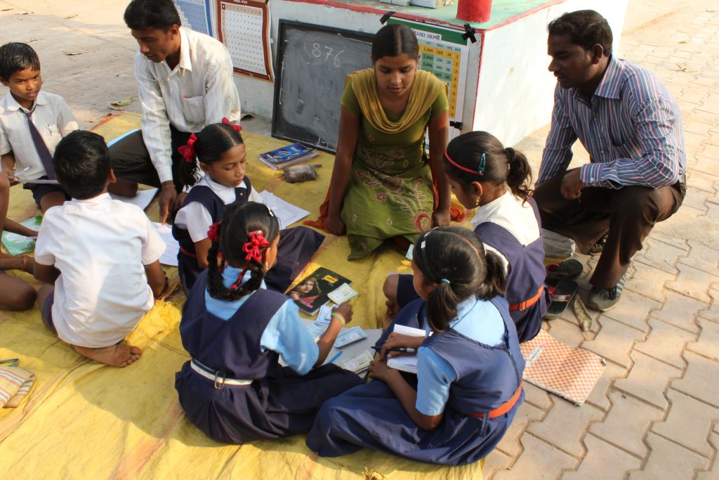 India: Girls Sit and Learn with Teachers