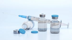 syringe with vaccine vials