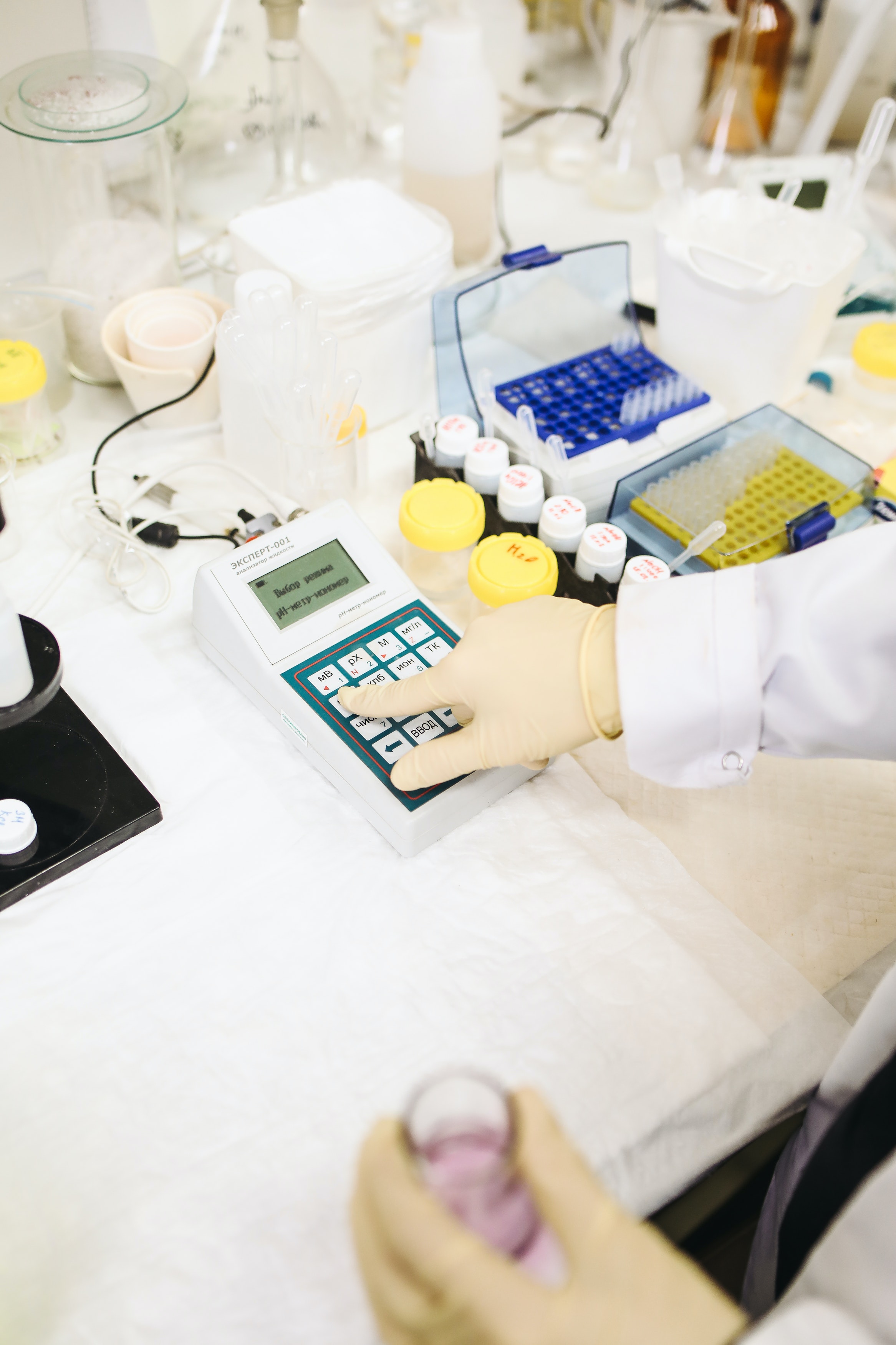 person using a reading meter in a laboratory