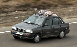 Image of a car driving o highway in Iran